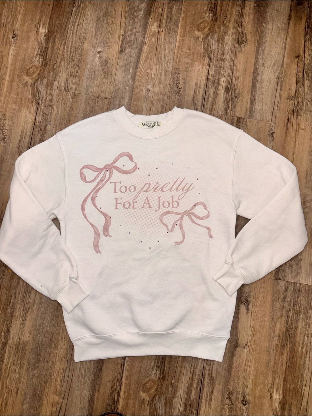 Wound Up White Crewneck Sweatshirt with Pink Bow Graphic